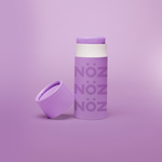 Load image into Gallery viewer, Purple Noz sunscreen standing with cap leaning on container
